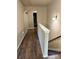 Spacious hallway with wood floors, white trim, and a view of the stairs at 269 Privet Cir, Suwanee, GA 30024