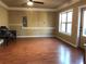 Spacious living room with laminate flooring and large window providing natural light at 269 Privet Cir, Suwanee, GA 30024