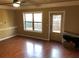 Spacious living room with laminate flooring, a large window, and a back door at 269 Privet Cir, Suwanee, GA 30024