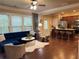 Open concept living area featuring a kitchen island, cozy seating, and lots of natural light at 269 Privet Cir, Suwanee, GA 30024