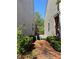 View of the narrow side yard showing the space between two houses and a wooden fence at 269 Privet Cir, Suwanee, GA 30024