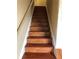 View of light wood stairs ascending to an upper level with neutral walls at 269 Privet Cir, Suwanee, GA 30024
