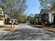 Street view of the neighborhood lined with trees and sidewalks that add curb appeal at 269 Privet Cir, Suwanee, GA 30024