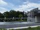 Scenic view of a modern water feature with a pedestrian bridge and lush greenery, enhancing the community's aesthetic appeal at 269 Privet Cir, Suwanee, GA 30024