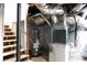 Spacious unfinished basement with water heater, open duct work and stairs at 875 Eleanor Nw Ct, Atlanta, GA 30318