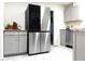 Modern kitchen with stainless steel refrigerator and sleek gray cabinets and drawers at 875 Eleanor Nw Ct, Atlanta, GA 30318