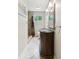 Bathroom featuring tile floors, a shower, a toilet, and a decorative vanity with a framed mirror at 1675 Commonwealth Trl, Cumming, GA 30041