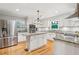 Modern kitchen features granite countertops, stainless steel appliances, and a central island at 1675 Commonwealth Trl, Cumming, GA 30041