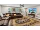 Relaxing living room with plush sectional sofa, decorative rug, and a large screen TV at 1675 Commonwealth Trl, Cumming, GA 30041