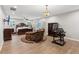 Spacious main bedroom featuring dark wood furniture, plank flooring and neutral colored walls at 1675 Commonwealth Trl, Cumming, GA 30041