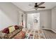 Relaxing sitting room area with wood-look floors and doorway access to a sunny office space at 1675 Commonwealth Trl, Cumming, GA 30041