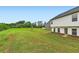 Expansive backyard featuring a well-maintained lawn with the house in the background at 229 Prescott St, Locust Grove, GA 30248