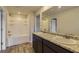 Bathroom featuring granite countertops and double sinks at 229 Prescott St, Locust Grove, GA 30248