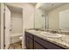 Bathroom featuring double sinks with granite countertops and a separate shower and tub at 229 Prescott St, Locust Grove, GA 30248