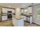 Kitchen with stainless steel appliances, granite counters, and white cabinetry at 229 Prescott St, Locust Grove, GA 30248