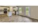 Modern kitchen with granite countertops, stainless steel appliances, and island at 229 Prescott St, Locust Grove, GA 30248