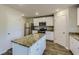 Modern kitchen with stainless steel appliances and granite countertops at 229 Prescott St, Locust Grove, GA 30248