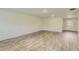 Bright living area with hardwood floors leading to the front door at 229 Prescott St, Locust Grove, GA 30248