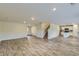 Open-concept living space with hardwood floors and staircase at 229 Prescott St, Locust Grove, GA 30248