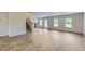 Spacious living area with hardwood floors and ample natural light at 229 Prescott St, Locust Grove, GA 30248