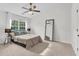 Tranquil bedroom with natural light, comfortable bed, and a view to the exterior at 3562 Greenwich Ave, Duluth, GA 30096