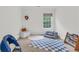 Cozy bedroom with soft textures, playful decor, and a window for natural light at 3562 Greenwich Ave, Duluth, GA 30096
