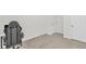 Neutral bedroom showcasing a computer desk with rolling chair, window, and neutral carpeting at 3562 Greenwich Ave, Duluth, GA 30096