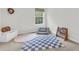 Bright bedroom featuring a window, playful decor, and soft textures creating a comfortable space at 3562 Greenwich Ave, Duluth, GA 30096