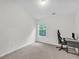 Minimalist bedroom with a window, computer desk, and chair, perfect for a home office at 3562 Greenwich Ave, Duluth, GA 30096