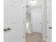 A brightly lit hallway with white doors and neutral walls, offering a clean and inviting atmosphere at 3562 Greenwich Ave, Duluth, GA 30096