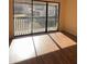 Sunlit room featuring sliding door access to balcony with fenced perimeter at 3575 Oakvale Road # 303, Decatur, GA 30034