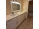 Bright bathroom features a white vanity with ample storage and a large mirror at 3575 Oakvale Road # 303, Decatur, GA 30034