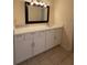 Modern bathroom features white cabinetry with a white counter top and mirror at 3575 Oakvale Road # 303, Decatur, GA 30034