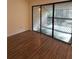 Bedroom with hardwood floors and sliding glass doors leading to a private balcony at 3575 Oakvale Road # 303, Decatur, GA 30034