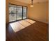 Dining area with hardwood floors, modern lighting, and balcony access for outdoor dining at 3575 Oakvale Road # 303, Decatur, GA 30034