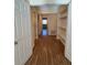 Hallway with wood floors and built in shelves at 3575 Oakvale Road # 303, Decatur, GA 30034