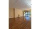Spacious living room with hardwood floors, fireplace, and sliding glass doors to balcony at 3575 Oakvale Road # 303, Decatur, GA 30034