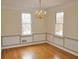 Dining room featuring hardwood floors, decorative molding, chandelier, and natural light at 3592 Galdway Dr, Snellville, GA 30039