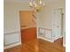 Elegant dining room with hardwood floors and chandelier, perfect for entertaining guests at 3592 Galdway Dr, Snellville, GA 30039