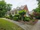 Charming single Gathering home featuring a wide front porch and beautiful landscaping at 3592 Galdway Dr, Snellville, GA 30039