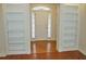 Welcoming foyer featuring hardwood floors and built in shelving at 3592 Galdway Dr, Snellville, GA 30039