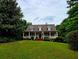 Charming single Gathering home featuring a wide front porch and well manicured front yard and inviting curb appeal at 3592 Galdway Dr, Snellville, GA 30039