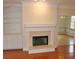 Cozy living room with a fireplace and built in shelving at 3592 Galdway Dr, Snellville, GA 30039