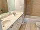 Bathroom with double vanity, large mirror, and tiled backsplash at 5872 Oakbrook Lake Ct, Norcross, GA 30093