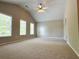 Spacious bedroom with a vaulted ceiling, ceiling fan, and plenty of natural light at 5872 Oakbrook Lake Ct, Norcross, GA 30093