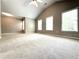 Bright, large bedroom with a vaulted ceiling, ceiling fan, and lots of natural light at 5872 Oakbrook Lake Ct, Norcross, GA 30093