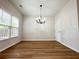 A dining room features wood-look flooring and a chandelier at 5872 Oakbrook Lake Ct, Norcross, GA 30093