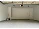Spacious two-car garage with painted floors and ample storage space at 5872 Oakbrook Lake Ct, Norcross, GA 30093