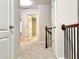 The upstairs hallway leads to the bedrooms at 5872 Oakbrook Lake Ct, Norcross, GA 30093