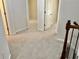 A carpeted hallway connects the upstairs bedrooms at 5872 Oakbrook Lake Ct, Norcross, GA 30093